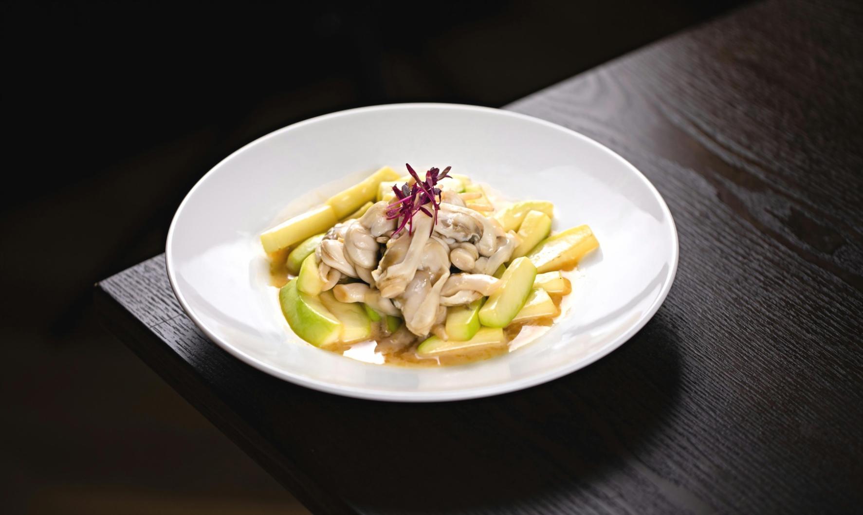 Student practicing garnish placement techniques learned through online platform instruction